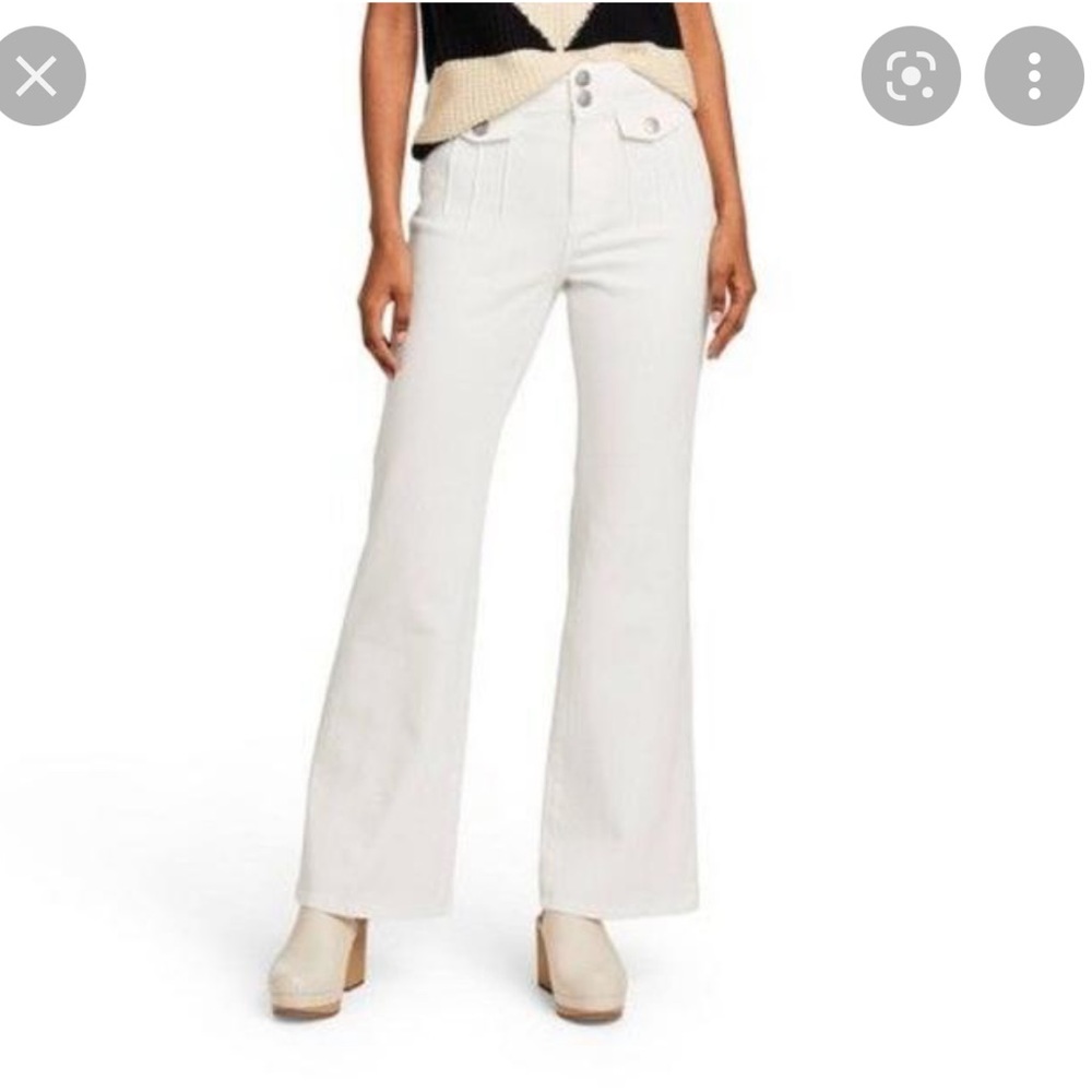 creamy white jeans, with flare legs, cool little details, low rise, size 0